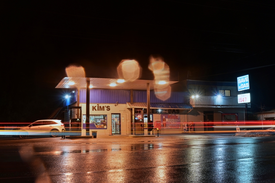 a nighttime shot in the rain of Kim's Grocery & Gas
